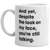 And Yet, Despite My Expression, You're Still Talking Mug - 11oz